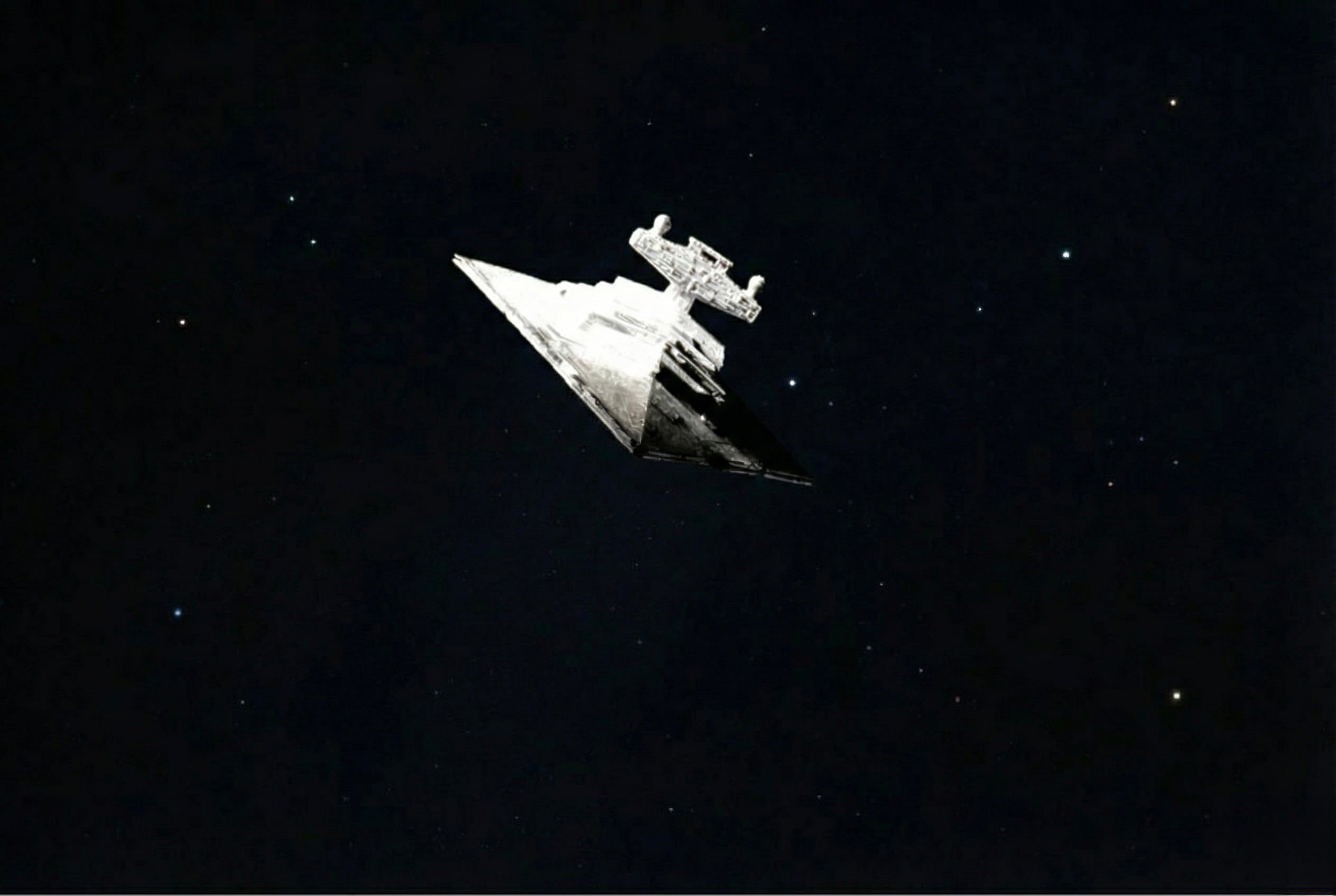 The photographed miniature composited into a dark star field.